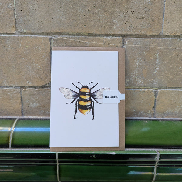 Greeting card with a bee illustration on a brick wall background
